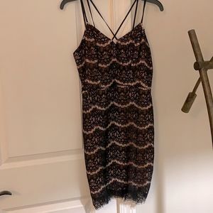 A nice black formal dress with a cream/blush pink undertone. Size S never worn.